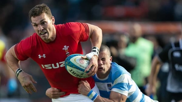 George North from Wales is tackled by Bautista Delguy from Argentina
