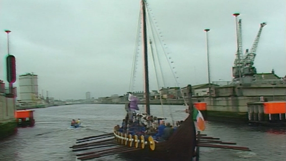 Replica Viking longship rows up the river Liffey (1988)