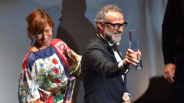 Italian chief Massimo Bottura (R) celebrates next to his wife Lara Gilmord after receiving the Best Restaurant award for his restaurant L´Osteria Francescana during the World's 50 Best Restaurants awards in Bilbao on June 19, 2018