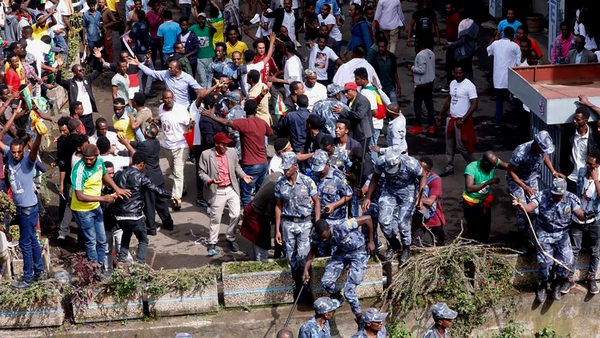 Ethiopian security forces intervene after the blast went off at the rally in Meskel Square
