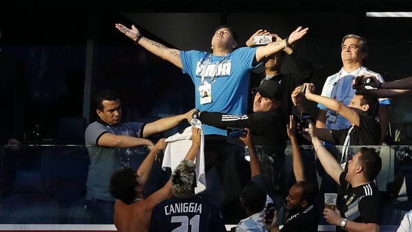 Diego Maradona celebrates Lionel Messi's opener