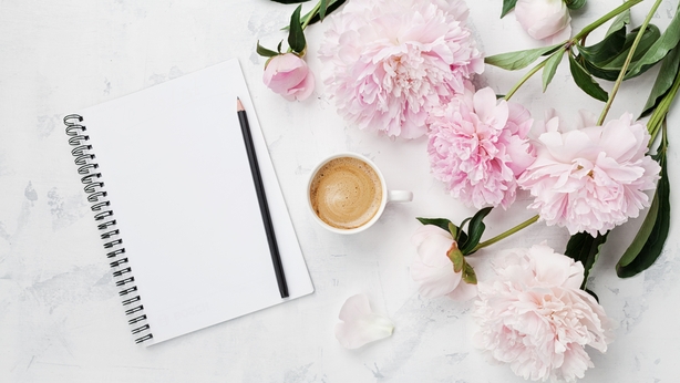 empty notebook, pencil and pink peony flowers