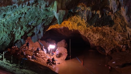 Rescuers install a water pump inside the Tham Luang Nang Non cave