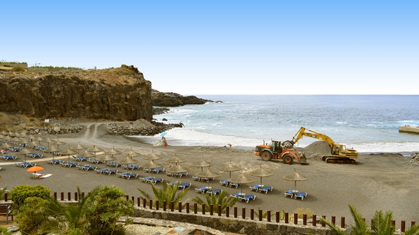 A bulldozer carrying out beach repair on the Canary Islands. Photo: Peter Etchells/iStock