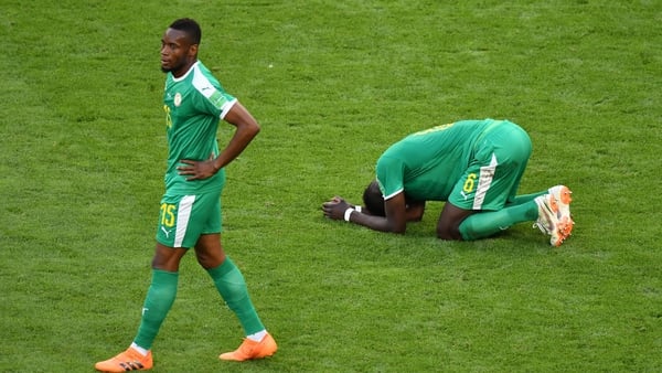 Senegal players react following their defeat to Colombia. The Africans became the first team in World Cup history to exit the tournament because of their inferior disciplinary record to Japan