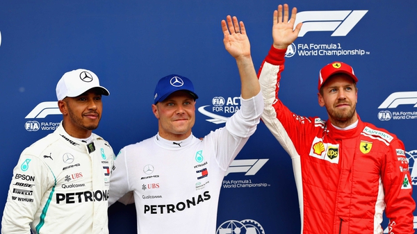 (L to R): Lewis Hamilton, Mercedes' Finnish driver Valtteri Bottas and Ferrari's Sebastian Vettel