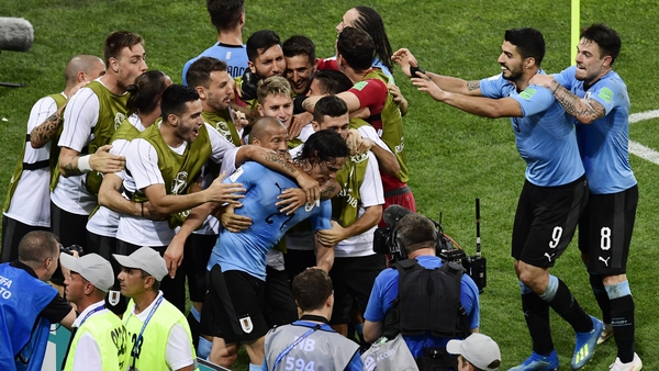 Edinson Cavani's brace has sent Uruguay through to the World Cup quarter-finals.