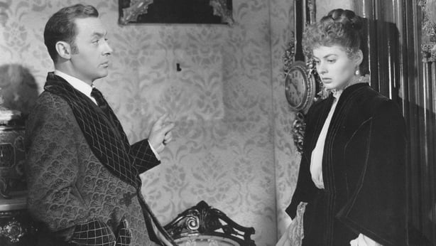 French-born American actor Charles Boyer talking to Swedish actress Ingrid Bergman in the film Gaslight. 1944