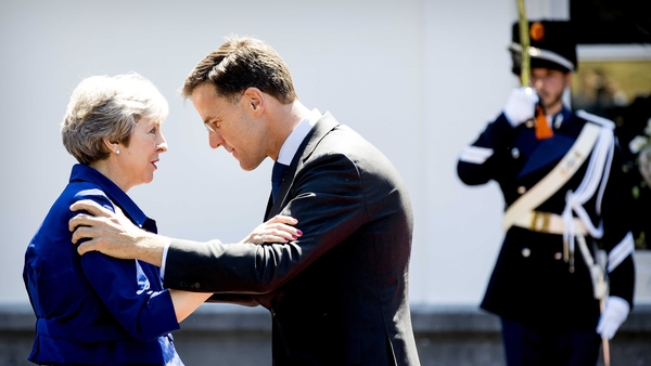 Dutch Prime Minister Mark Rutte greets Theresa May ahead of a working lunch in The Hague