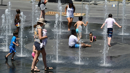 Children playing in a fountain in Montreal as temperatures soar
