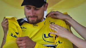 Slovakia's Peter Sagan puts on the overall leader's yellow jersey