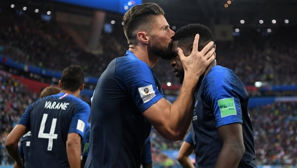A kiss on the forehead - Olivier Giroud plants a smacker on the goalscorer Samuel Umtiti