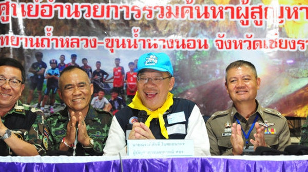 Rescue operation coordinator Narongsak Osatanakorn (2nd R) tells a media conference that the mission was a success