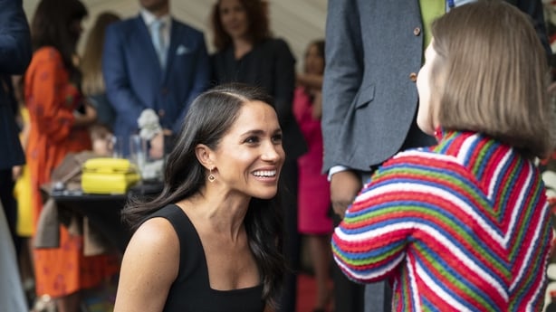 Markle chatting with Sinéad Burke