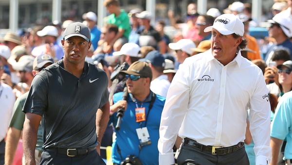 Tiger Woods (L) and Phil Mickelson are set for a winner-takes-all shootout