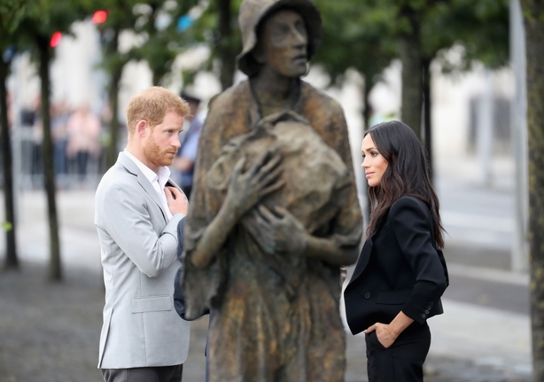 Prince Harry, Duke of Sussex and Meghan, Duchess of Sussex view the famine memorial on the bank of the River Liffey