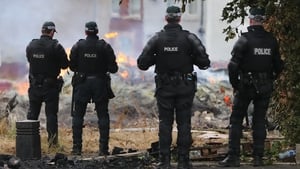 PSNI officers at the site of a bonfire in the Bloomfield Avenue area of Belfast