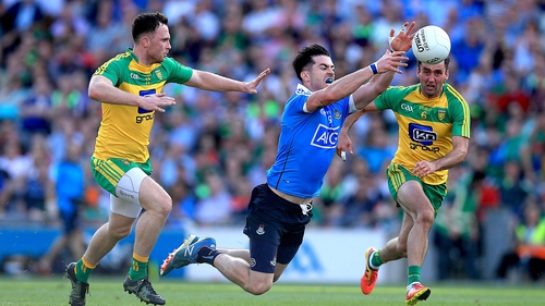 Michael Darragh McAuley of Dublin with Martin McElhinney of Donegal in action during the 2016 quarter-final between the sides