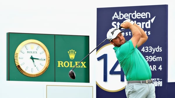 Graeme McDowell battled back with three birdies on the back nine but will not be in the mix on Sunday