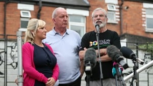 Michelle O'Neill, Bobby Storey and Gerry Adams on stage at the event