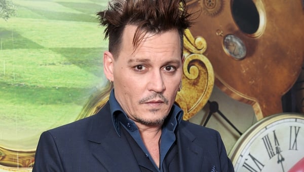 Johnny Depp settles lawsuit with former managers