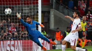 Alisson on action for Roma against the Reds in last season's Champions League