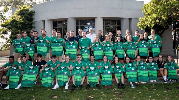 Ireland's men's and women's teams receive their jerseys from IRFU President Ian McIlrath ahead of the tournament kick-off