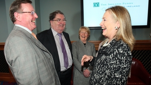 Hillary Clinton enjoys a laugh with David Trimble and John Hume during a visit to Belfast in 2012