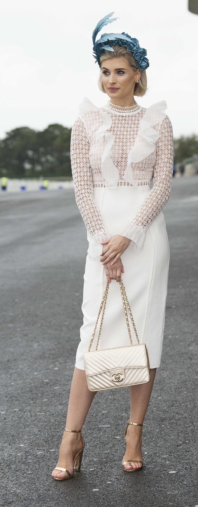 Katie Geoghegan looked every bit the lady in a white dress and beautiful blue headpiece. Check out that Chanel purse!