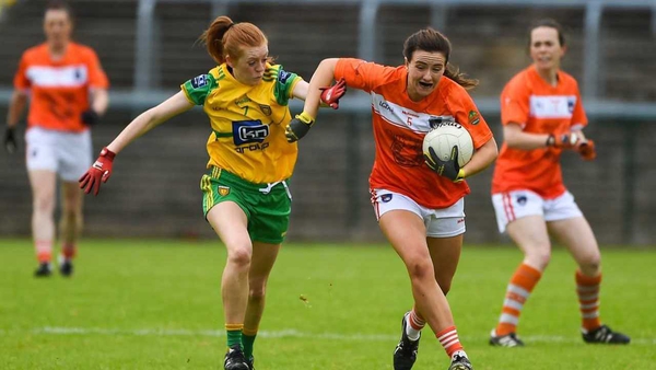 Tiarna Grimes of Armagh is tackled by Deirdre Foley in the Ulster final