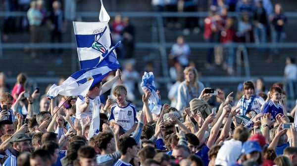 Monaghan supporters celebrate on the Salthill pitch after beating Galway