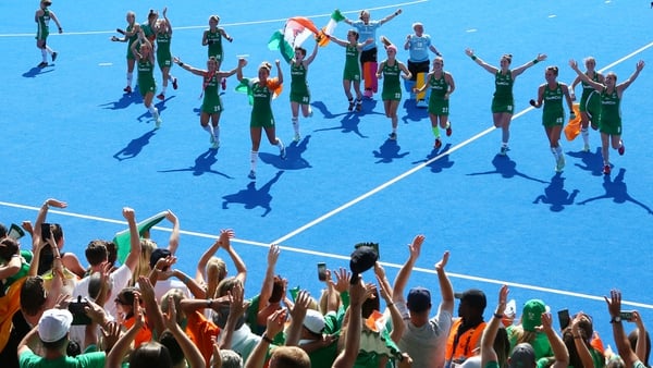 Victorious Irish players celebrate the win over Spain with supporters.