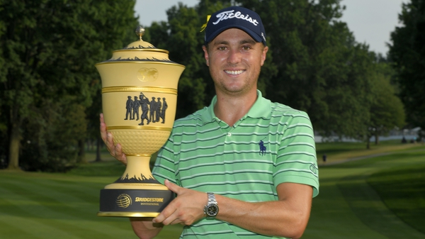 Justin Thomas poses with the Gary Player Cup