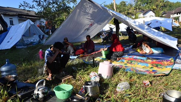 Villagers shelter in tents in west Lombok after the deadly quake
