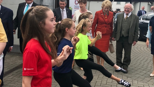 President Michael D Higgins and his wife Sabina watch some Irish dancing at the Fleadh
