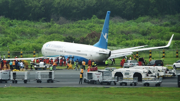 The plane came to rest on its belly off the runway