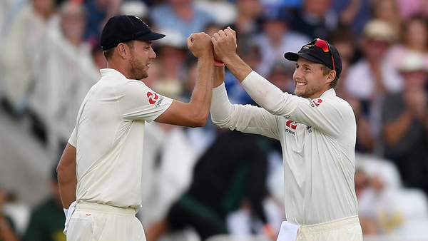 Stuart Broad celebrates with Joe Root after taking another Indian wicket