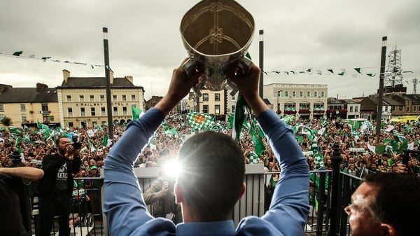 Limerick captain Declan Hannon lifts the Liam MacCarthy Cup outside Colbert station