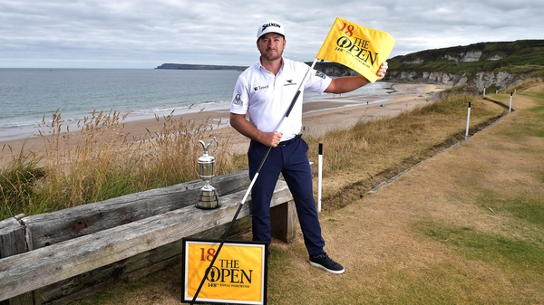 Graeme McDowell poses with the Claret Jug at the Antrim course