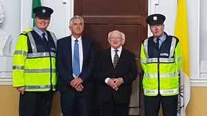 President Michael D Higgins pictured with Insp John Lambert, Det Garda Kevin Clarke and Garda William Dunne. All three garda members are on duty in Phoenix Park today, and were on duty for the Pope's visit in 1979 (Pic: Garda Press Office)