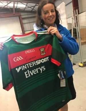 Audrey Elliott holds up the Mayo jersey signed by the Pope at Knock airport