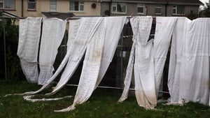 In Tuam, Co Galway, bedsheets with the names of children who died at the former Mother and Baby Home were tied to the fence of the home