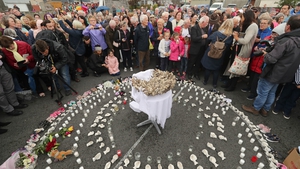 People gather to protest at the site of the former Tuam home for unmarried mothers at the same time as Pope Francis held a mass in Dublin. Photo: Niall Carson PA Images/Getty Images