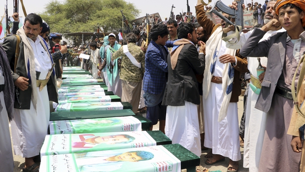 Thousands of Yemenis take part in a mass funeral for children killed in an air strike by the Saudi-led coalition