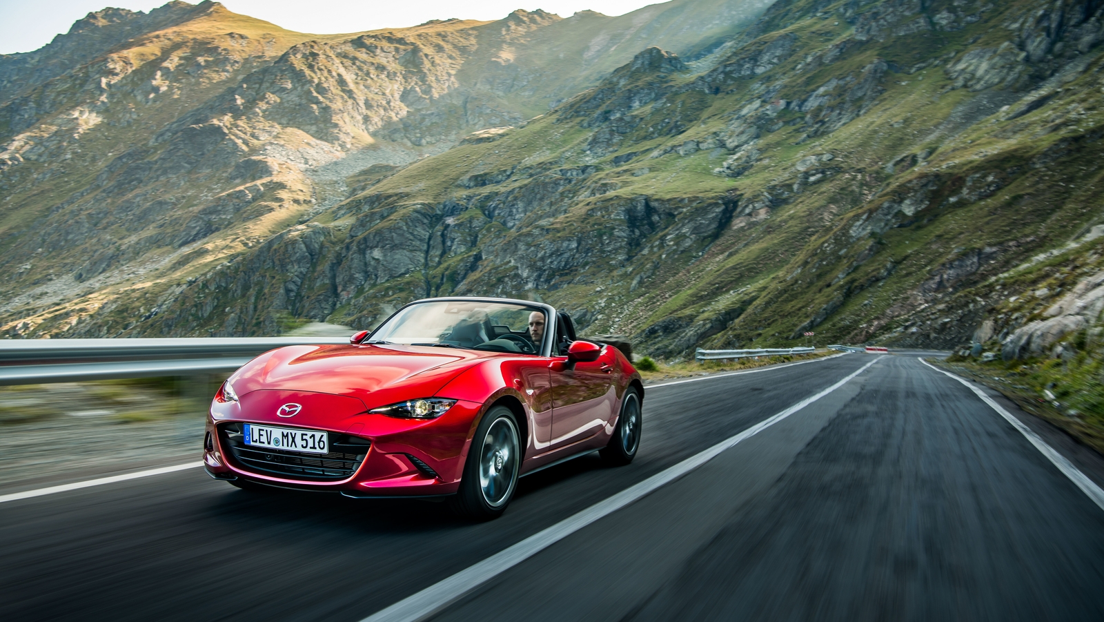 Mazda revises its MX 5 roadster with more powerful engine.