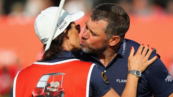 Westwood of England kisses his girlfriend and caddie, Helen Storey
