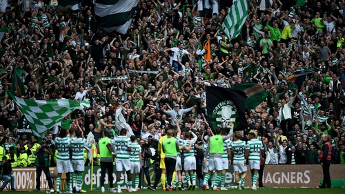 Celtic are cheered off the field after their defeat of Rangers