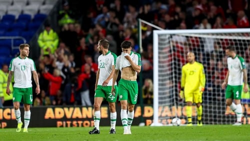 Ireland players dejected after conceding one of three first-half goals in Cardiff