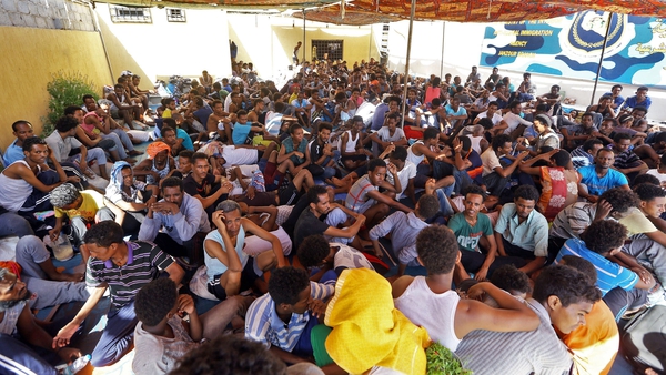 Migrants inside a shelter in Tripoli
