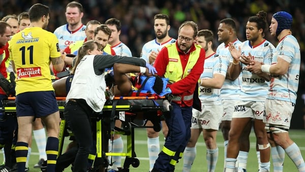 Samuel Ezeala of Clermont is evacuated from the pitch during a Top 14 rugby match between Racing 92 and ASM Clermont Auvergne